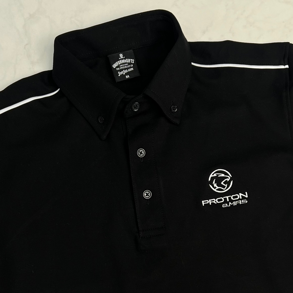 Black polo shirt with Proton logo on a light gray background