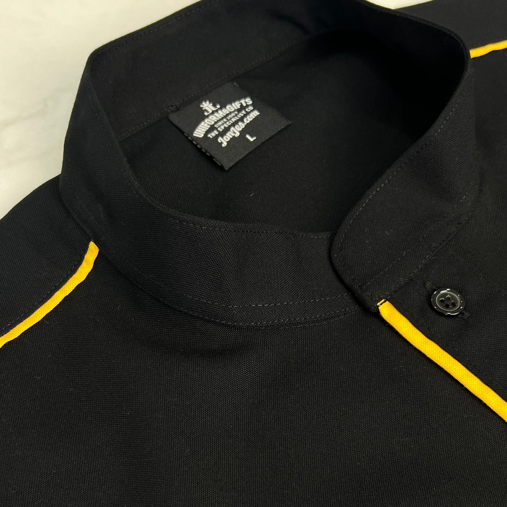 Close-up of a black shirt with yellow trim